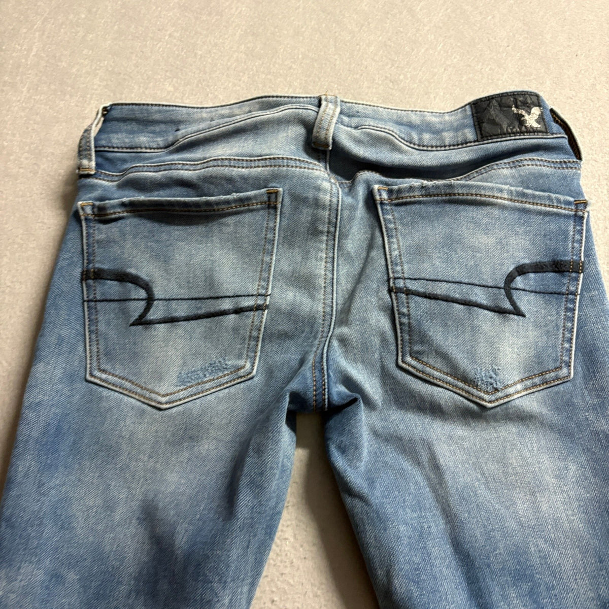 American Eagle Super Low Jegging Jeans Womens 4 Blue Distressed Raw Hem Stretch