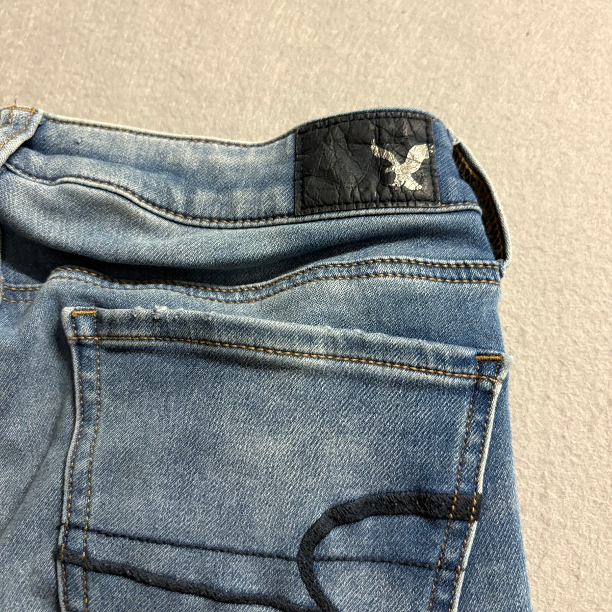 American Eagle Super Low Jegging Jeans Womens 4 Blue Distressed Raw Hem Stretch