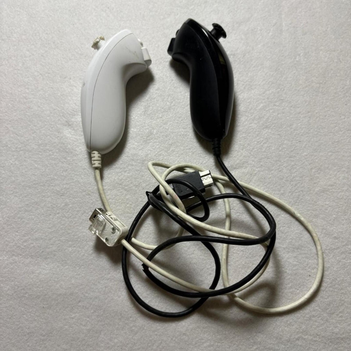 Nintendo Wii Nunchuck Controllers Black and White Lot of 2 Damaged For Parts