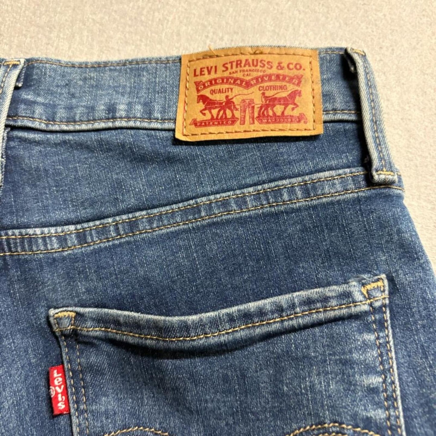 Levi's 720 High Rise Super Skinny Jeans Womens 27x30 Blue Distressed Raw Hem