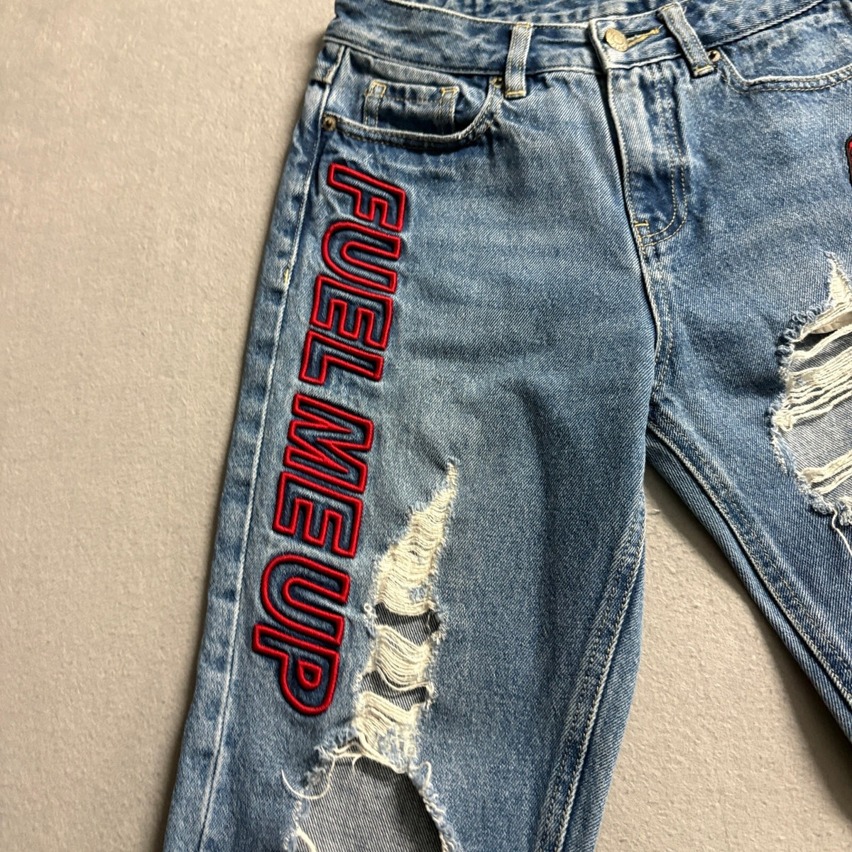 MO&Co Premium Jeans Womens 25 Blue Distressed Ripped Graphic Patch Denim