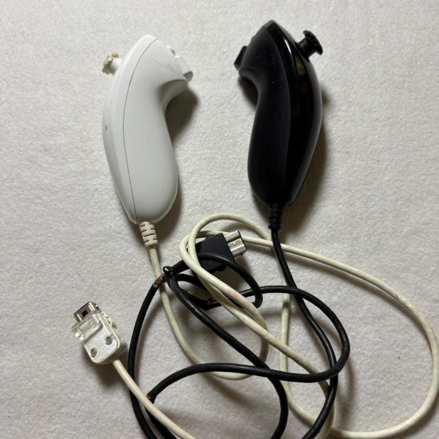 Nintendo Wii Nunchuck Controllers Black and White Lot of 2 Damaged For Parts