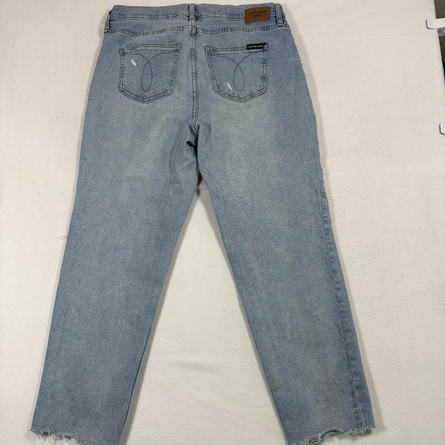 Calvin Klein womens jeans 12/31 light wash distressed straight leg frayed hem Y2K