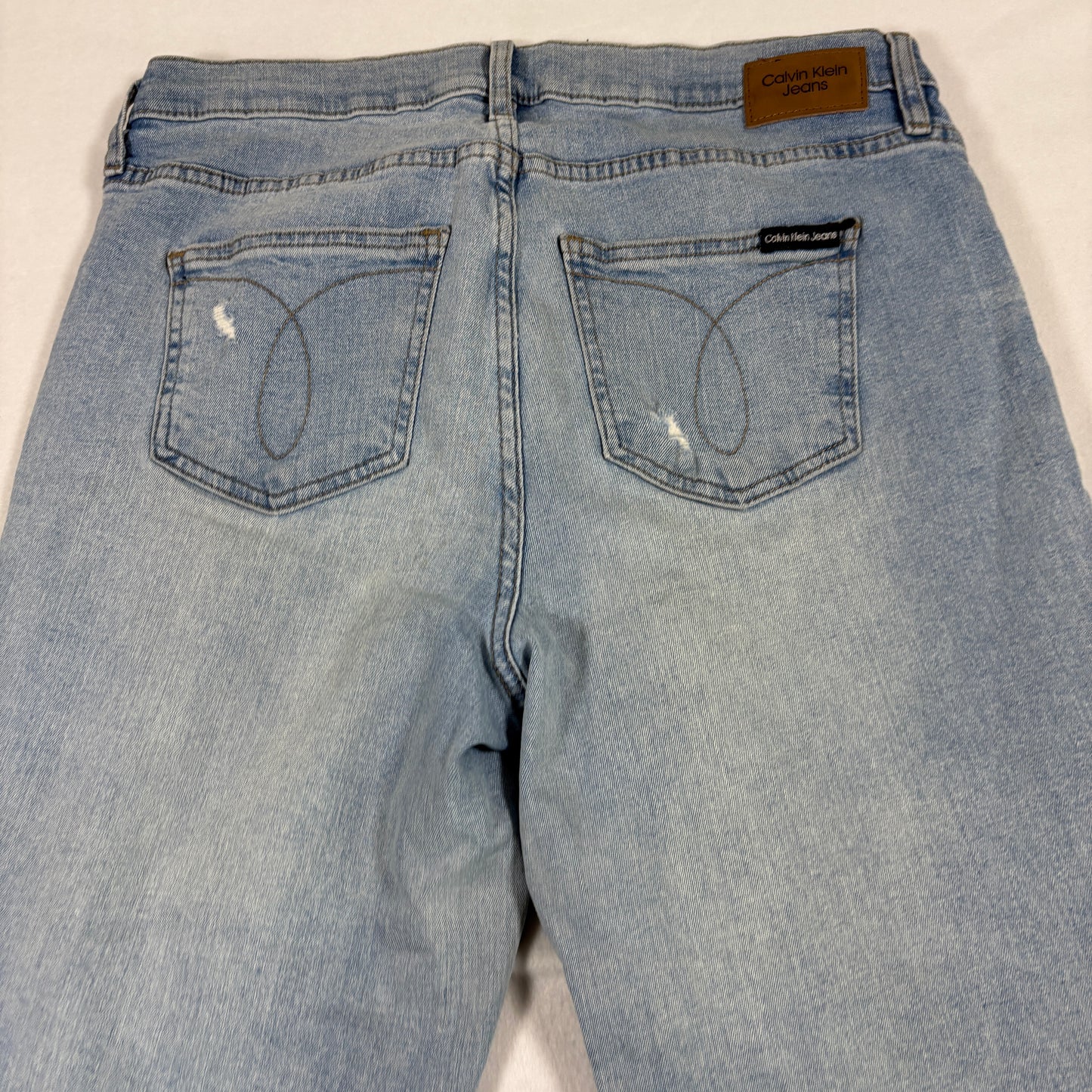 Calvin Klein womens jeans 12/31 light wash distressed straight leg frayed hem Y2K