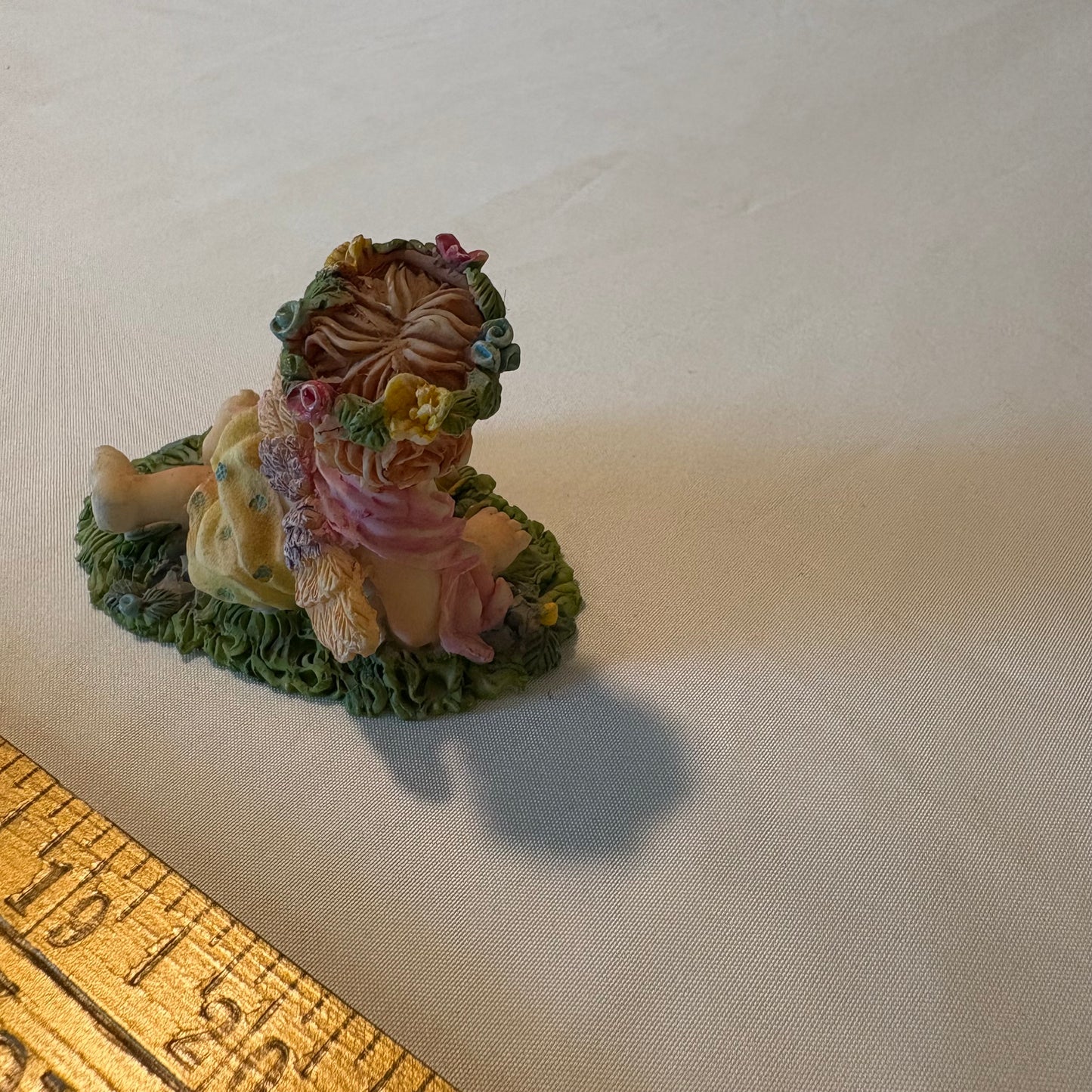 Vintage Cherub Angel Figurine Laying on Grass with Wings & Flower Crown 4" Tall