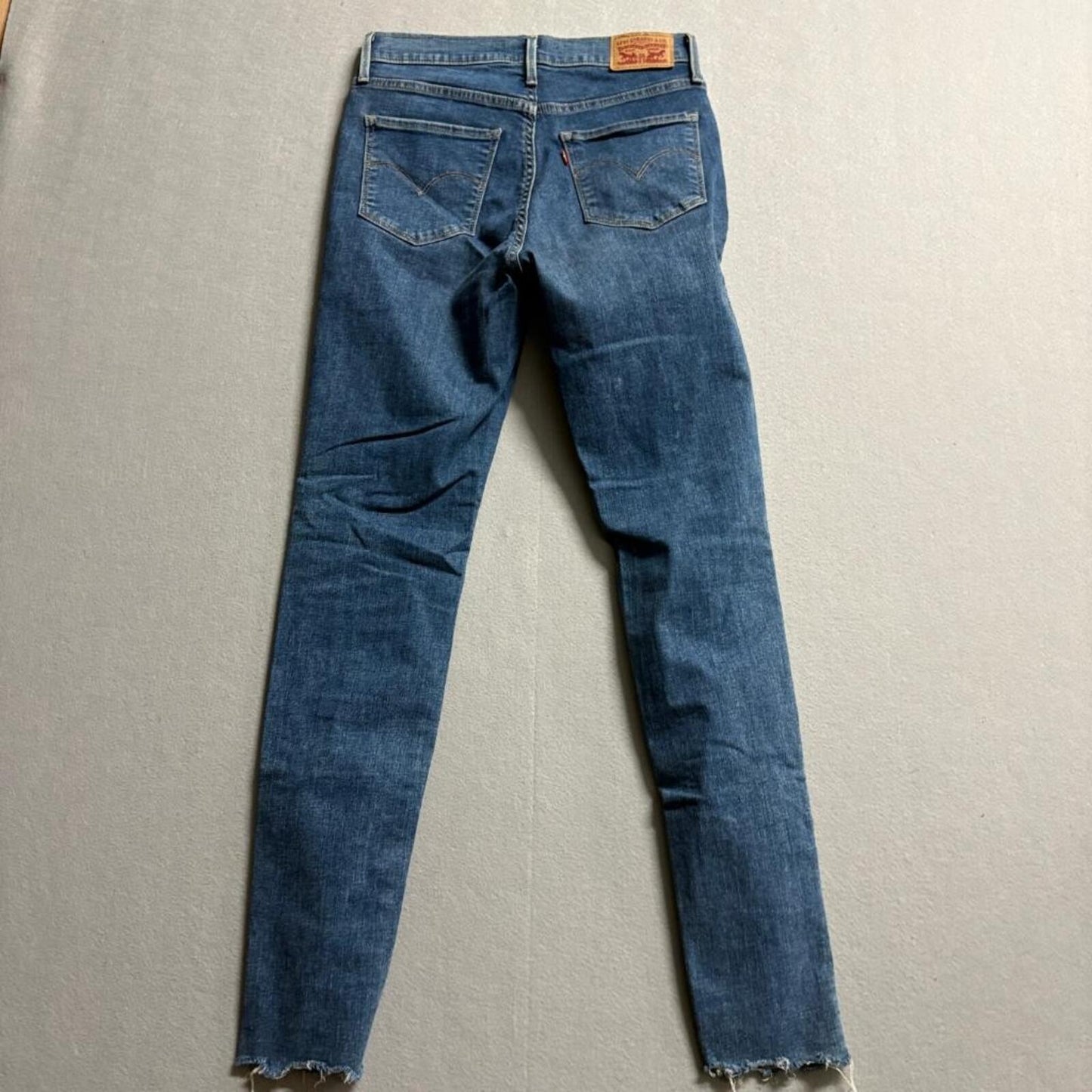 Levi's 720 High Rise Super Skinny Jeans Womens 27x30 Blue Distressed Raw Hem