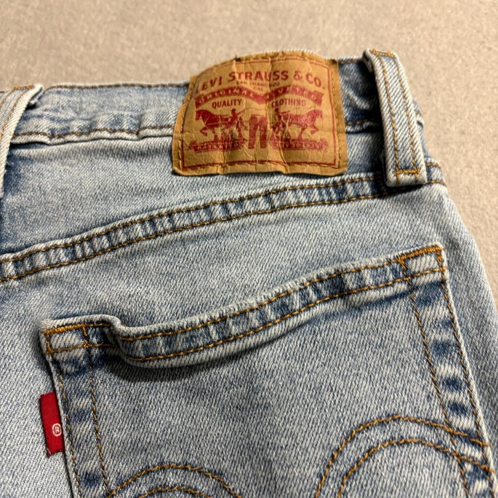 Levis Wedgie Straight Jeans Womens 26 Light Wash Distressed Raw Hem Denim