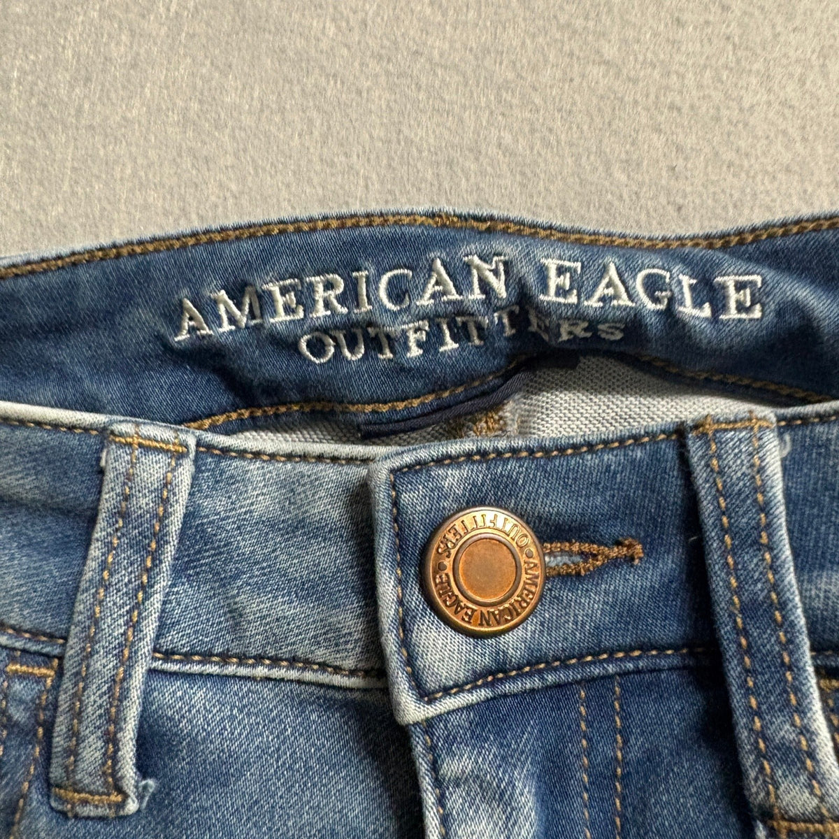 American Eagle Super Low Jegging Jeans Womens 4 Blue Distressed Raw Hem Stretch